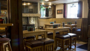 TV and Merchandise in seating area O’Connors Bar Ballycastle | Irish Hospitality, Food & Entertainment on Ann Street