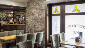 Seats beside window in O'Connors Bar O’Connors Bar Ballycastle | Irish Hospitality, Food & Entertainment on Ann Street