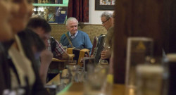 Man in trad session O’Connors Bar Ballycastle | Irish Hospitality, Food & Entertainment on Ann Street